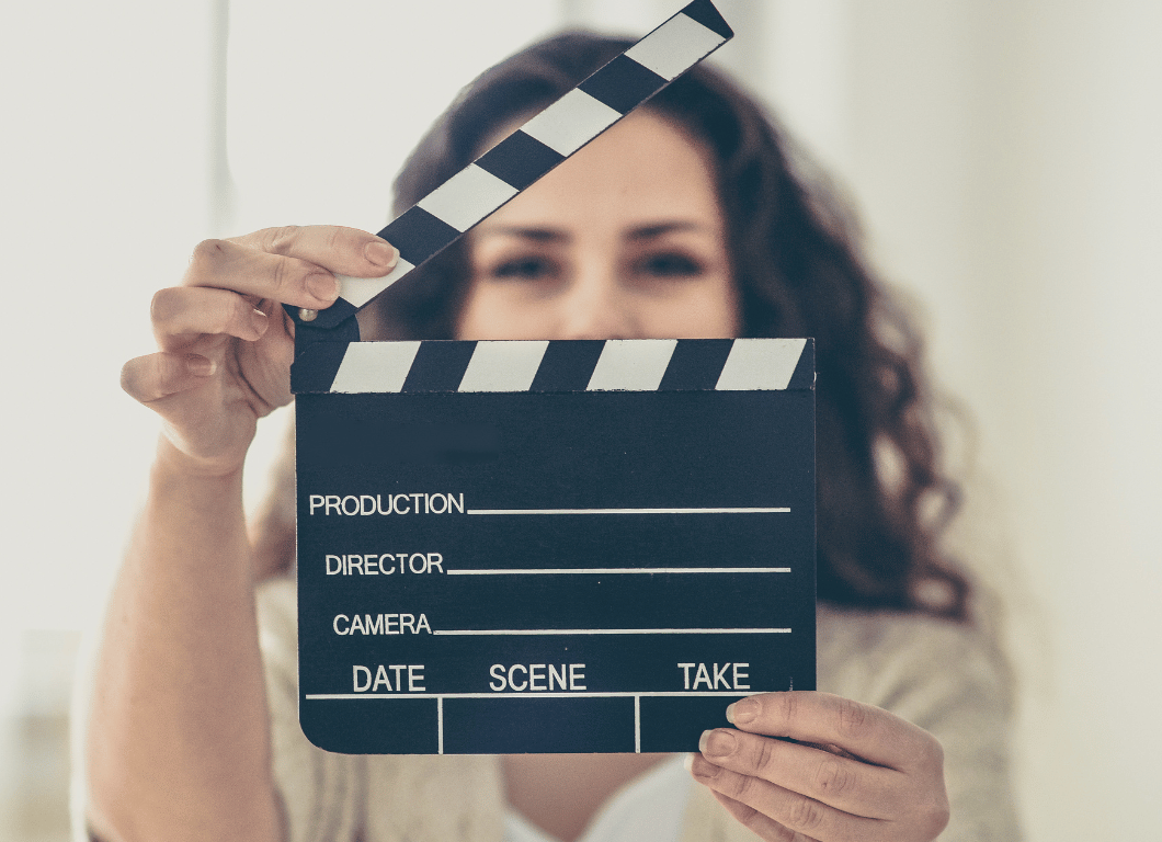 Woman holding a film clapboard